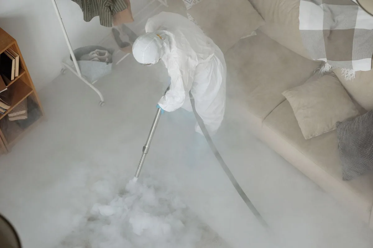 Biohazard cleanup technician in protective equipment, Holmen, WI